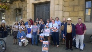 Members of 38 Degrees, Global Justice Cambridge, Cambridge People's Assembly Against Austerity and other groups, Cambridge Guildhall, anti-TTIP action, 22 August 2015. Photo by Sanja McMaster Hirose