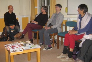 Nick Dearden with three Oxford WDM activists sitting down